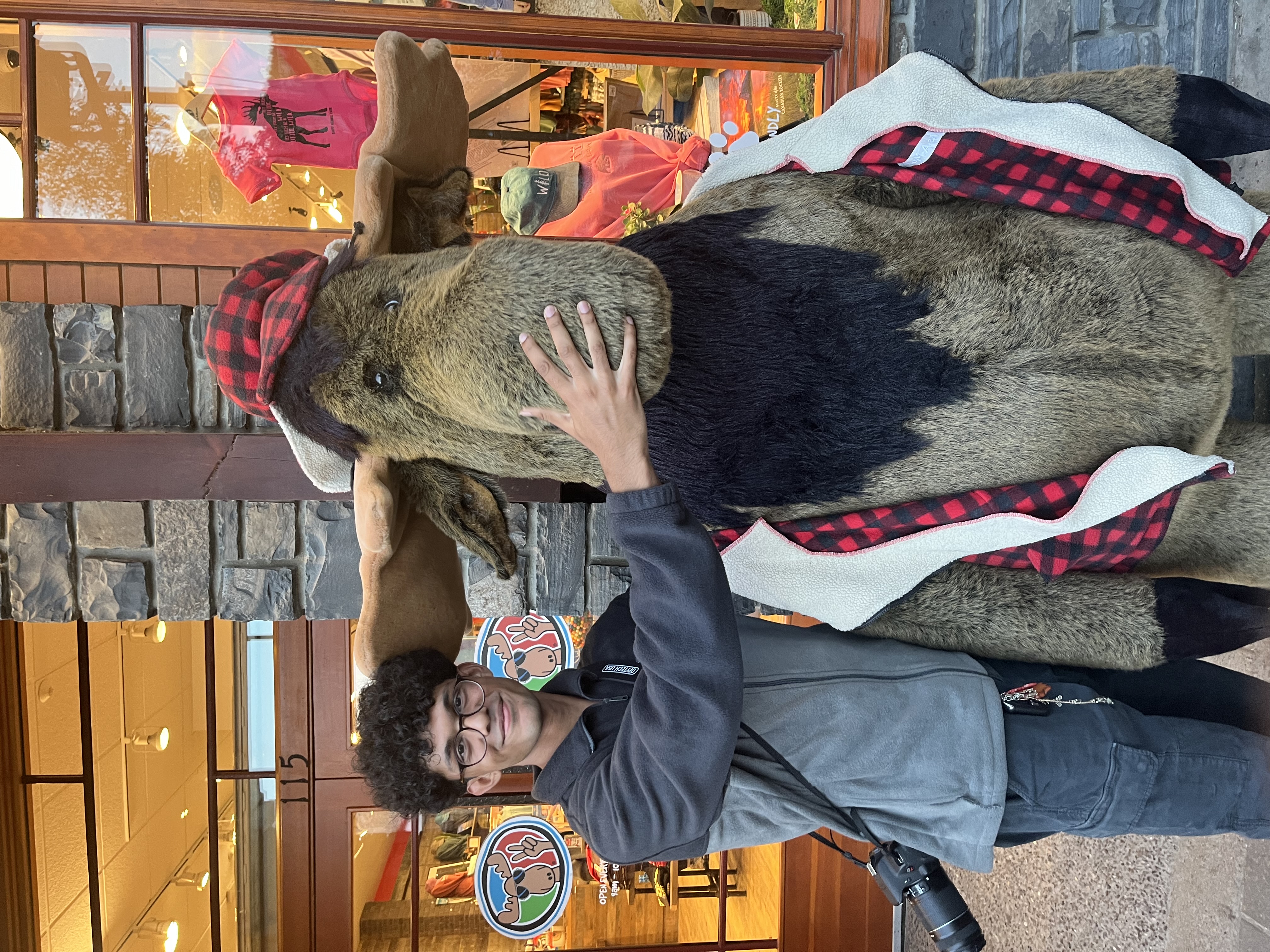 Laksh sitting outside coffee shop