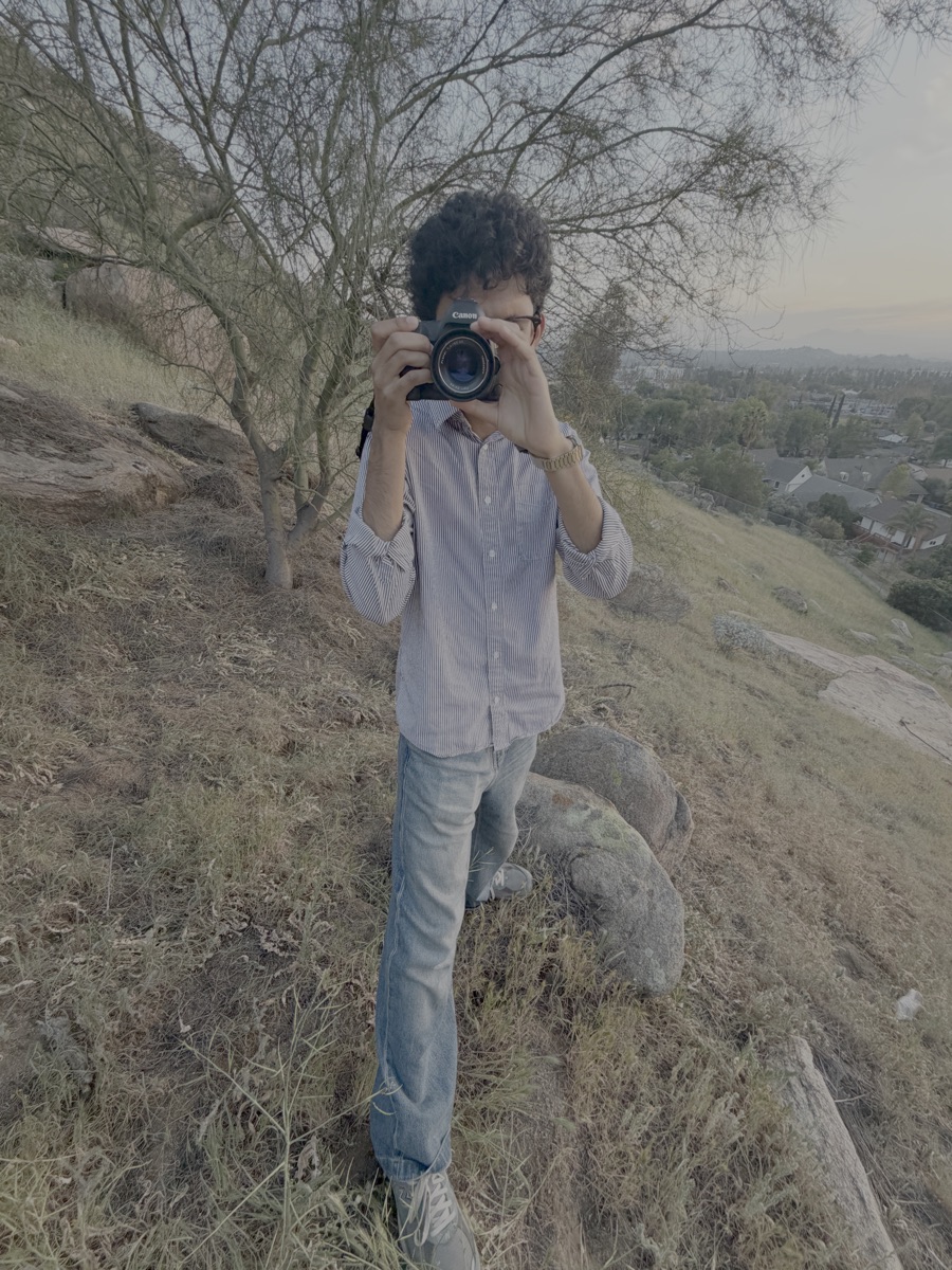 Laksh sitting outside coffee shop
