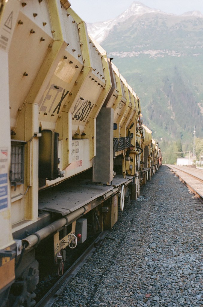 Freight train on mountain tracks