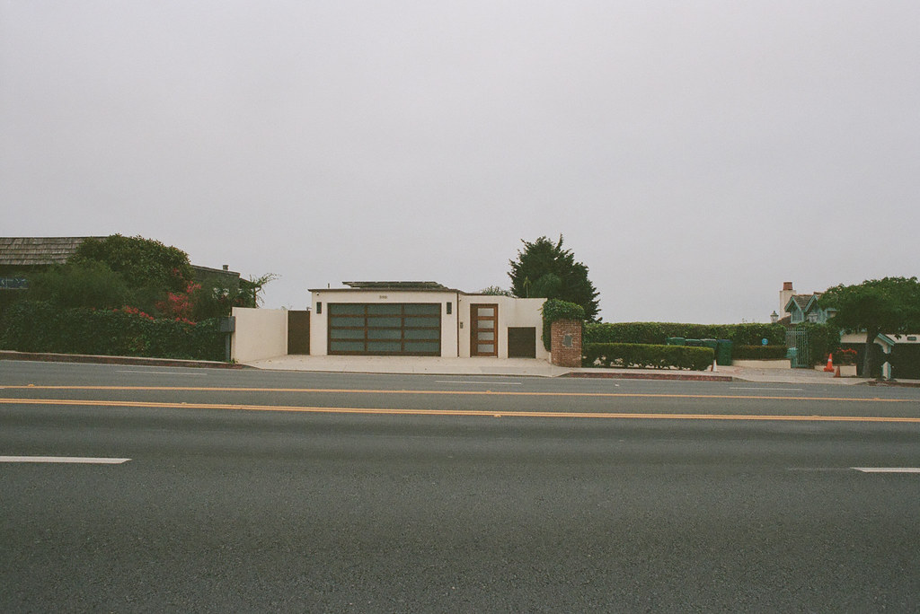 Modern house on foggy road